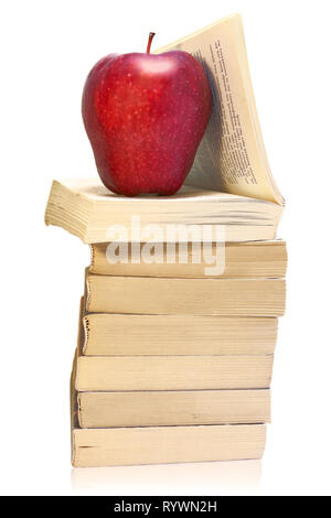 Stack of books with red apple isolated on white Stock Photo