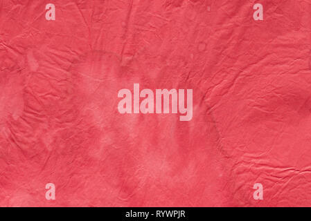 red color watercolor painted background texture on creased paper Stock Photo
