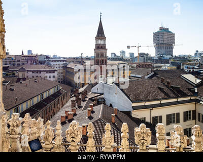 MILAN, ITALY - FEBRUARY 24, 2019: view of bell tower of church San Gottardo a Palazzo over Milan city from roof of Milan Cathedral (Duomo di Milano).  Stock Photo