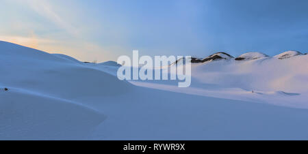 Winter landscape at the daytime in Krivoy Rog, Ukraine. Mountains covered by snow. Landscape on the blue sky background. Snow desert landscape. Stock Photo