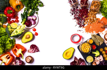 Vegetables and Fruits Arrangement on white background. Different colorful fresh vegan food. Flat lay. Place for inscription. Stock Photo
