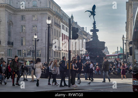 LONDON - FEBRUARY 15, 2019: People visit Piccadilly Circus in London. London is the most populous city in the UK with 13 million people living in its  Stock Photo