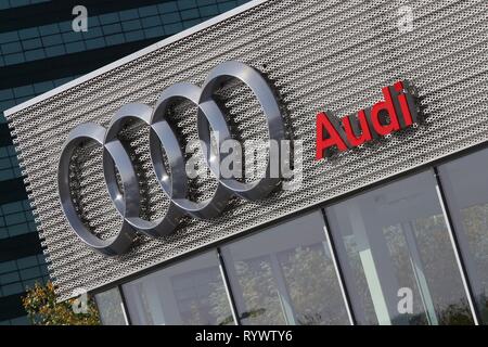Bucharest, Romania - October 17, 2018: The logo of Audi car brand is seen on a showroom in Bucharest, Romania. This image is for editorial use only. Stock Photo