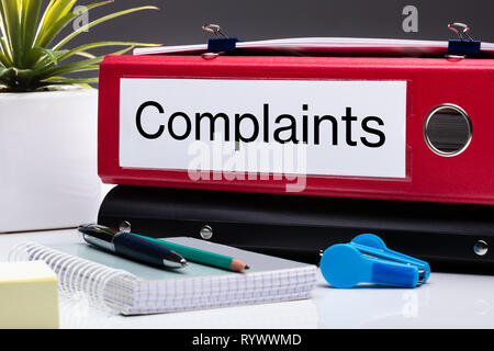 Close Up Of Compliance Folder And Office Supplies On Office Desk Stock Photo