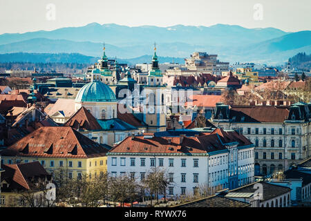 Ljubljana, Slovenia - January 15, 2019: Panoramic view of the cityscape in Ljubljana and mountains in Slovenia. Stock Photo