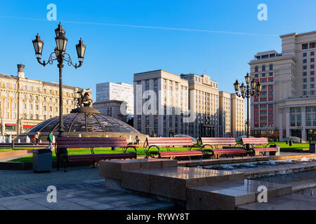Moscow, Russia - September 20, 2014: People on Manezhnaya square in Moscow city in Russia in the morning. Stock Photo