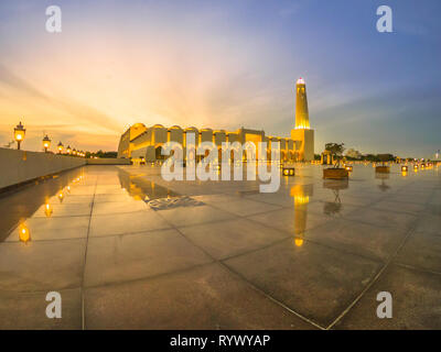 wide-angle-view-of-state-grand-mosque-with-a-minaret-at-twilight-reflecting-on-marble-pavement-outdoors-qatar-state-mosque-middle-east-arabian-rywyap.jpg