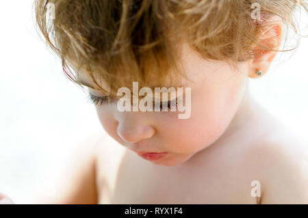 Close-up potrait of adorable little girl short haired Stock Photo