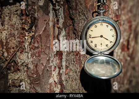 retro clock on a rope on a beautiful background Stock Photo