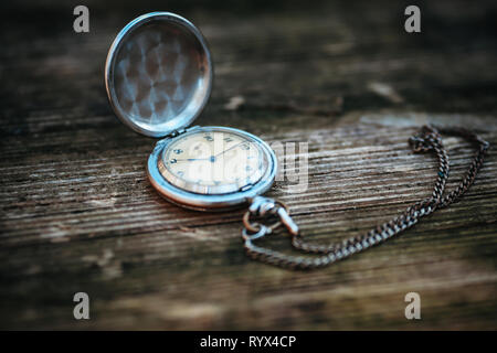 retro clock on a rope on a beautiful background Stock Photo