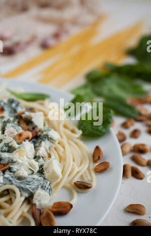 Pasta with spinach and cheese Stock Photo