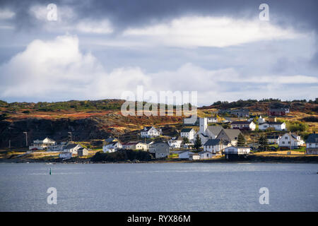 View of a small town on a rocky Atlantic Ocean Coast during a cloudy day. Taken in Twillingate, Newfoundland, Canada. Stock Photo