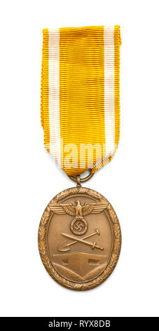 German World War Two West Wall Defence Medal Isolated on White. Stock Photo