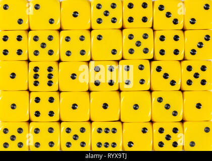 Background pattern of yellow dices, random ordered Stock Photo