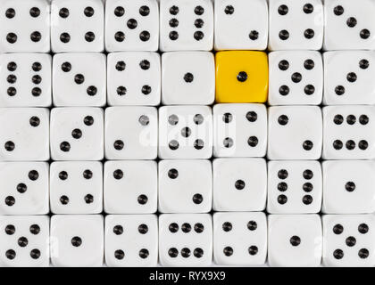 Background of random ordered white dices with one yellow cube Stock Photo
