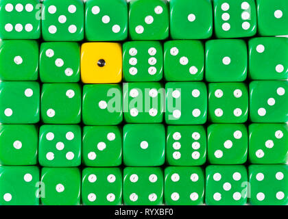 Background of random ordered green dices with one yellow cube Stock Photo