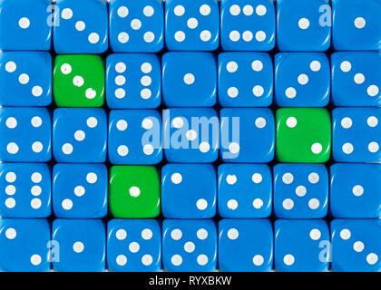 Background of random ordered blue dices with three green cubes Stock Photo