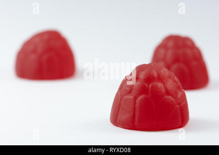 Trio of raspberries on a white background Stock Photo