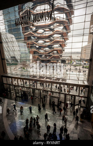 New York, USA. 15th Mar, 2019. The Vessel is seen from the lobby of the Hudson Yards mall on the West Side of Manhattan on its grand opening day, Friday, March 15, 2019. Retailers, including the Neiman Marcus department store, opened their shops in the development which was built on a platform over the West Side railroad yards. Office, residential, public space and retail space comprise the first phase in what is arguably the most expensive construction project ever built in the U.S.   (© Richard B. Levine) Credit: Richard Levine/Alamy Live News Stock Photo