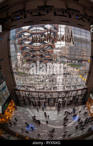 New York, USA. 15th Mar, 2019. The Vessel is seen from the lobby of the Hudson Yards mall on the West Side of Manhattan on its grand opening day, Friday, March 15, 2019. Retailers, including the Neiman Marcus department store, opened their shops in the development which was built on a platform over the West Side railroad yards. Office, residential, public space and retail space comprise the first phase in what is arguably the most expensive construction project ever built in the U.S.   (Â© Richard B. Levine) Credit: Richard Levine/Alamy Live News Stock Photo