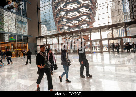 New York, USA. 15th Mar, 2019. The Vessel is seen from the lobby of the Hudson Yards mall on the West Side of Manhattan on its grand opening day, Friday, March 15, 2019. Retailers, including the Neiman Marcus department store, opened their shops in the development which was built on a platform over the West Side railroad yards. Office, residential, public space and retail space comprise the first phase in what is arguably the most expensive construction project ever built in the U.S.   (© Richard B. Levine) Credit: Richard Levine/Alamy Live News Stock Photo