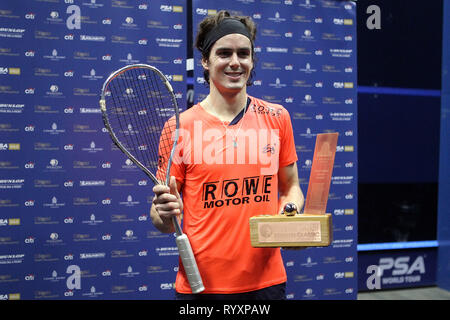 London, UK. 15th March, 2019. Paul Coll of New Zealand poses with the winners trophy after his victory. Citigold Canary Wharf Squash Classic, day 6, the Final, at the East Wintergarden in Canary Wharf , London on Friday 15th March 2019.   pic by  Steffan Bowen/Andrew Orchard sports photography/Alamy Live news Stock Photo