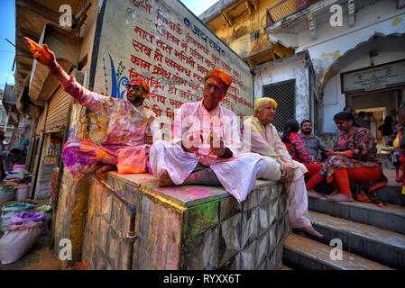 Devotees seen in different mood of celebration during the Lathmar Holi Festival of Barsana. The myth behind this Lathmar Holi is related with Hindu God Lord Krishna who as per local belief came from his hometown Nandgaon to his lovers place at Barsana and teased Radha and her friends. With this common belief since more than 100 years, women of Barsana still maintaining the ritual and beating the outcomers of Nandgaon with sticks (Lathi) to maintain the tradition on this particular day. Stock Photo