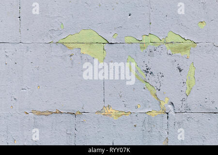 Texture, light grey wall background. Weathered wall fragment with  scratches and cracks Stock Photo