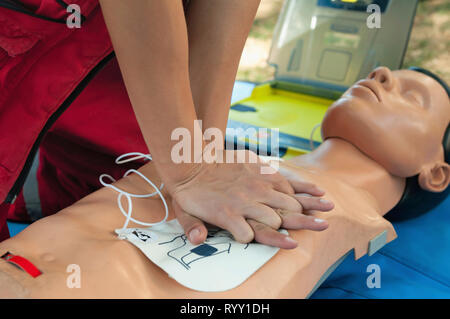 Performing CPR on CPR dummy. Stock Photo