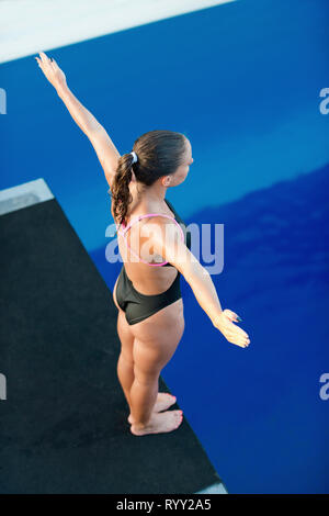 Female diver on platform. Stock Photo