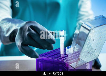 Technician preparing biological sample for deep freezing. Stock Photo
