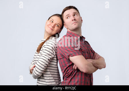 Young european couple standing against white gray background Stock Photo
