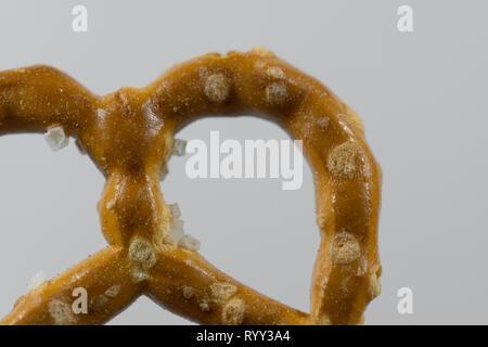 Macro image of a pretzel on white background Stock Photo