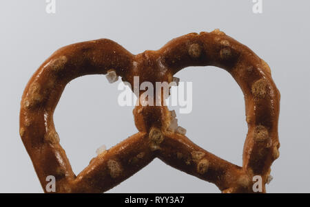 Macro image of a pretzel on white background Stock Photo