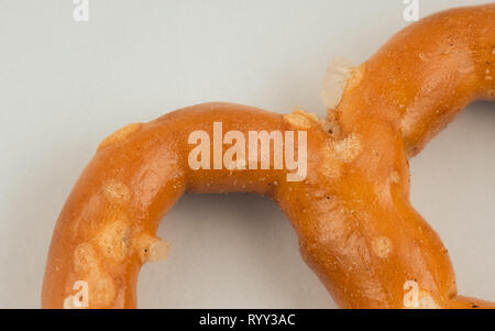 Macro image of a pretzel on white background Stock Photo