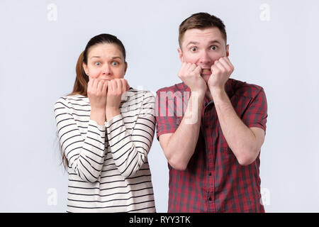 Scared young european man and woman. Facial expression concept. Stock Photo