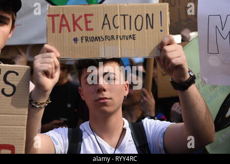 A student seen holding a placard saying Take Action, Fridays For Future during the protest. Thousands of pupils, teenagers and university students have marched today in Barcelona, Spain, and in more than 60 cities and town around the country, to protest against climate change and urge the government to take action. The global movement has been inspired by teenage activist Greta Thunberg, who has been skipping school every Friday since August to protest outside the Swedish parliament. Stock Photo