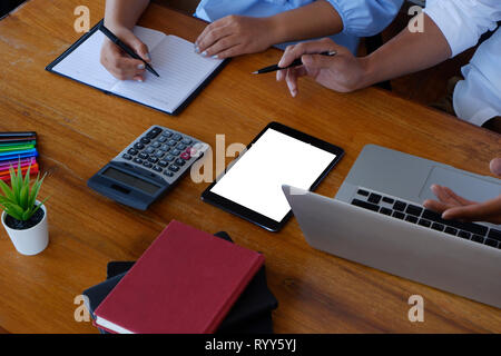 female secretary sitting next to boss taking down note in office  Concept of business routine - Image Stock Photo