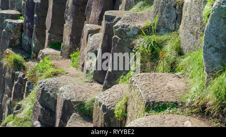 Some of the rock formations in the Giants Causeway it is the area where rock basalt formed from the volcanic eruption Stock Photo