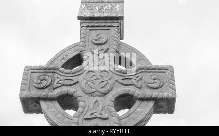 A high cross outside the Rock of Cashel in Ireland this spot is one of the tourist destinations in Ireland Stock Photo