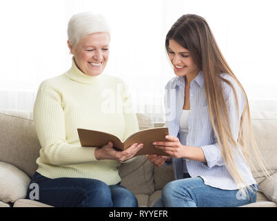Financial consultant presenting bank investments to senior woman Stock Photo