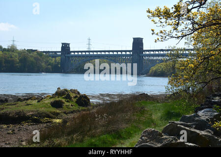 Looking across the Menai Strait towards the Britannia bridge and Welsh mainland Stock Photo