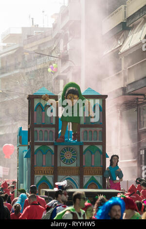 XANTHI, GREECE - MARCH 10, 2019: Masquerade participants march and have fun in colorful costumes. Small and big groups of Greek people parade annually Stock Photo