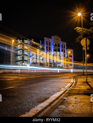 traffic light trails at night in Portsmouth Stock Photo