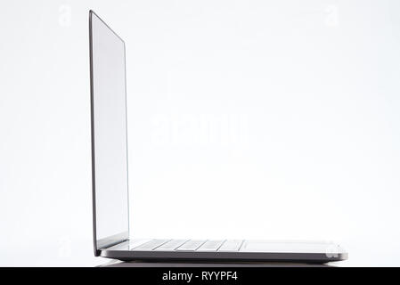 Side view of modern laptop isolated on white background Stock Photo