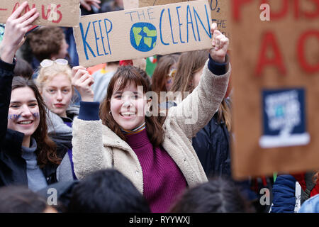 Brussels, Belgium. 15th Mar, 2019. People holding placards take part in a demonstration against climate change in Brussels, Belgium, March 15, 2019. Thousands of school students across Belgium abandoned classrooms for a day of climate demonstrations on Friday as part of the 'Global Strike for Future', local press reported. Credit: Zhang Cheng/Xinhua/Alamy Live News Stock Photo