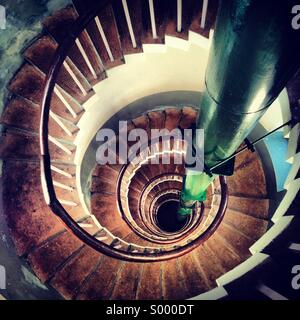 Looking down a spiral staircase Stock Photo