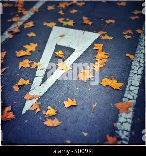 Gives way yield sign on autumm in Barcelona. Catalonia, Spain Stock Photo