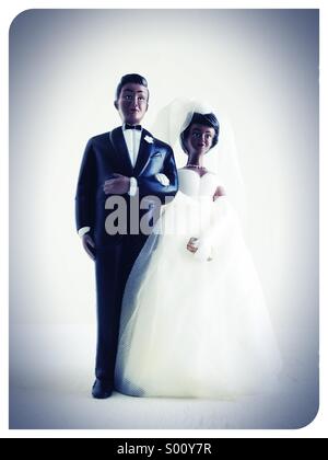 A wedding cake topper of a black heterosexual couple. Stock Photo