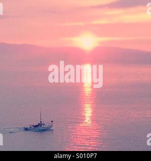 Fishing boat in sunset Stock Photo